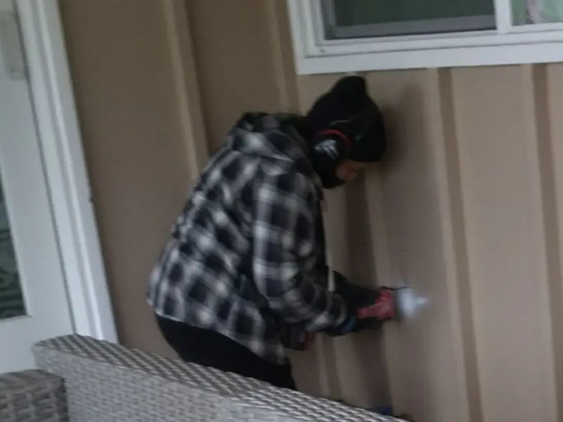 Professional electrician installing an exterior outlet in Cozad