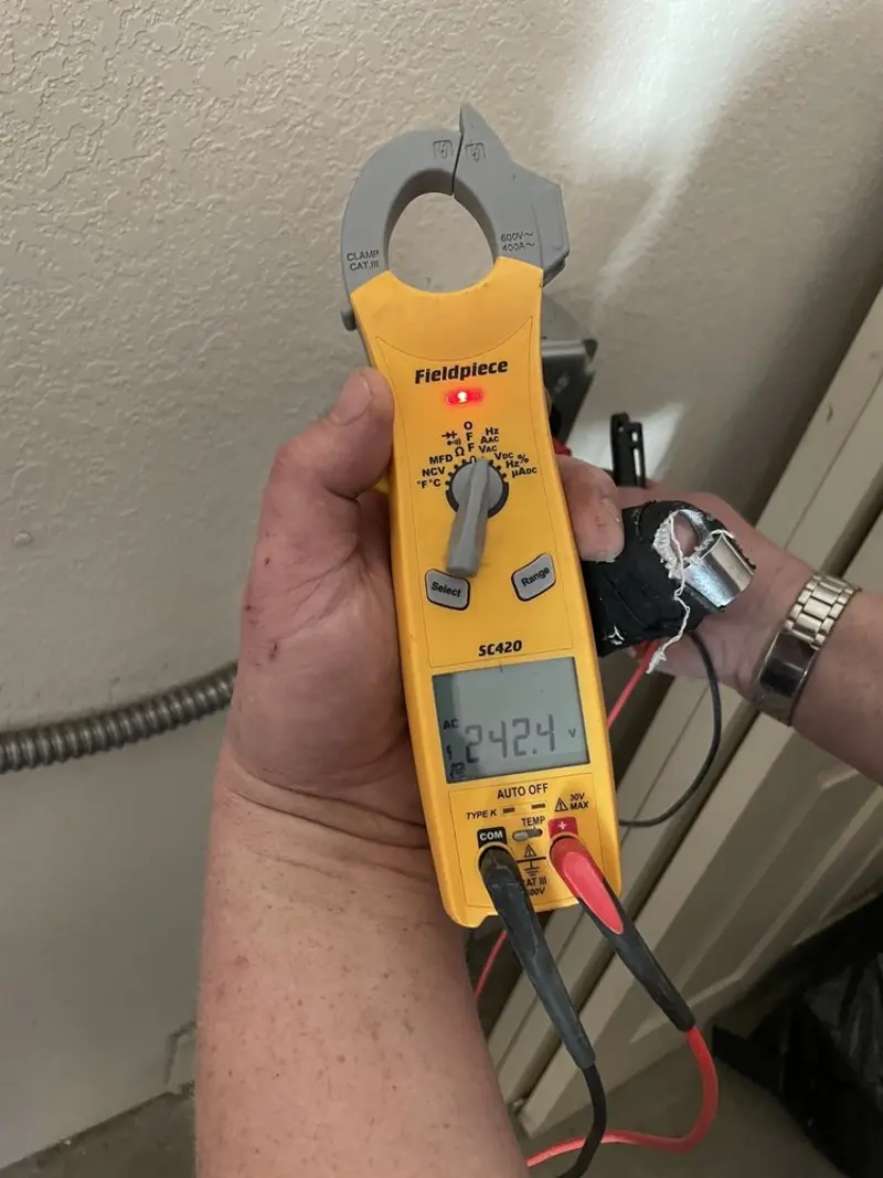 Voltage testing with clamp meter during Hot Tub / Pool Electrical Wiring in Cozad